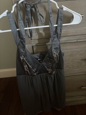 grey cami/halter top with cheetah detailing and light brown trim at the bottom